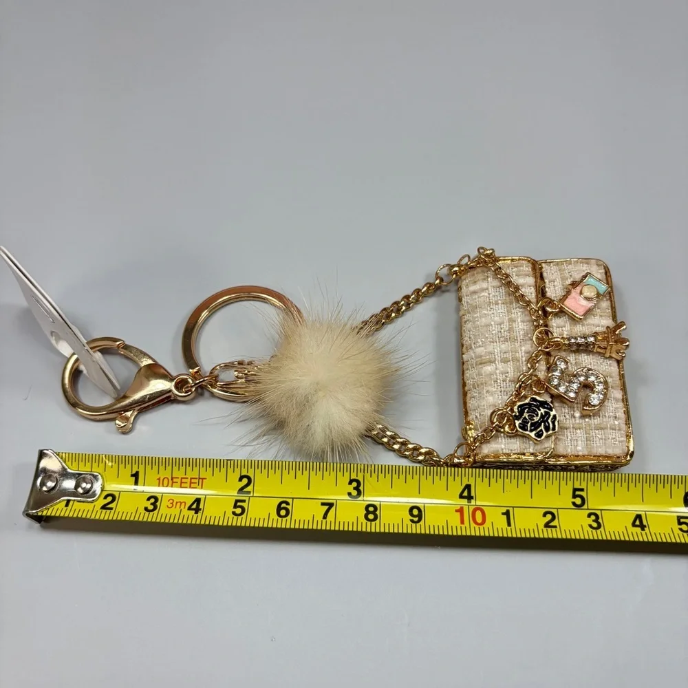 Chic Cream Tweed Mini Bag Keychain with Gold Chain and Pom